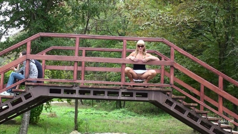 Outdoor Pissing: Amateur Woman Urinating on Road - Explicit Public Porn Pic