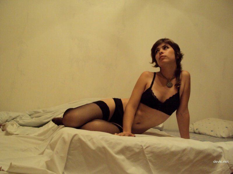 Sexy Young Girl in Stockings - Explicit Amateur Photo of Hot Babe Showing Off Legs and Lingerie