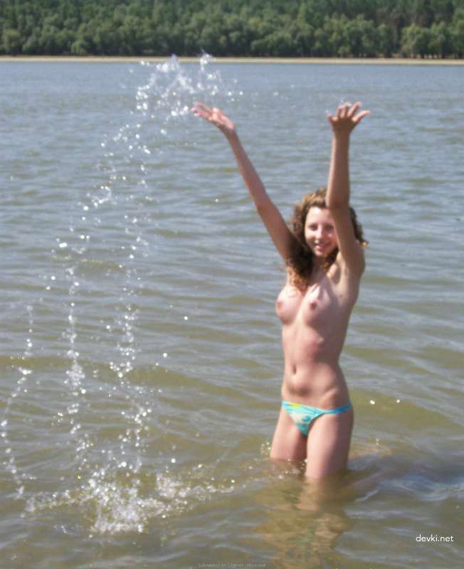 Topless Beach Babe: Explicit Amateur Sea Bathing Photo