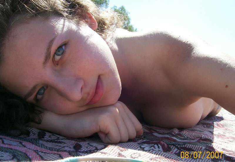 Topless Beach Babe: Explicit Amateur Sea Bathing Photo