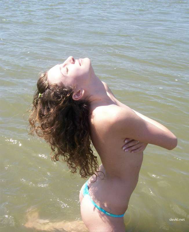 Topless Beach Babe: Explicit Amateur Sea Bathing Photo