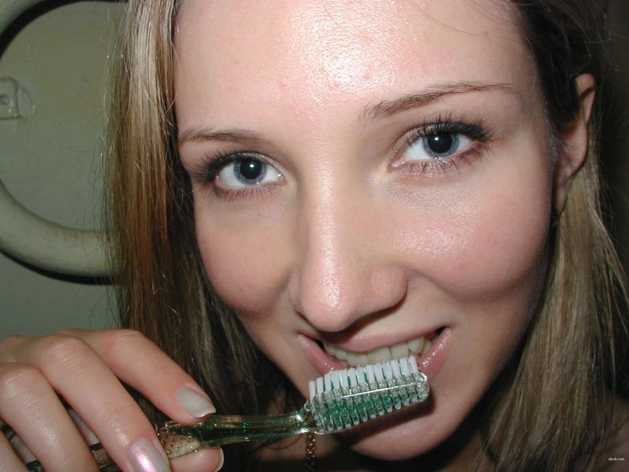 Amateur Babe Teases Wet Pussy with Toothbrush - Explicit Solo Masturbation Photo