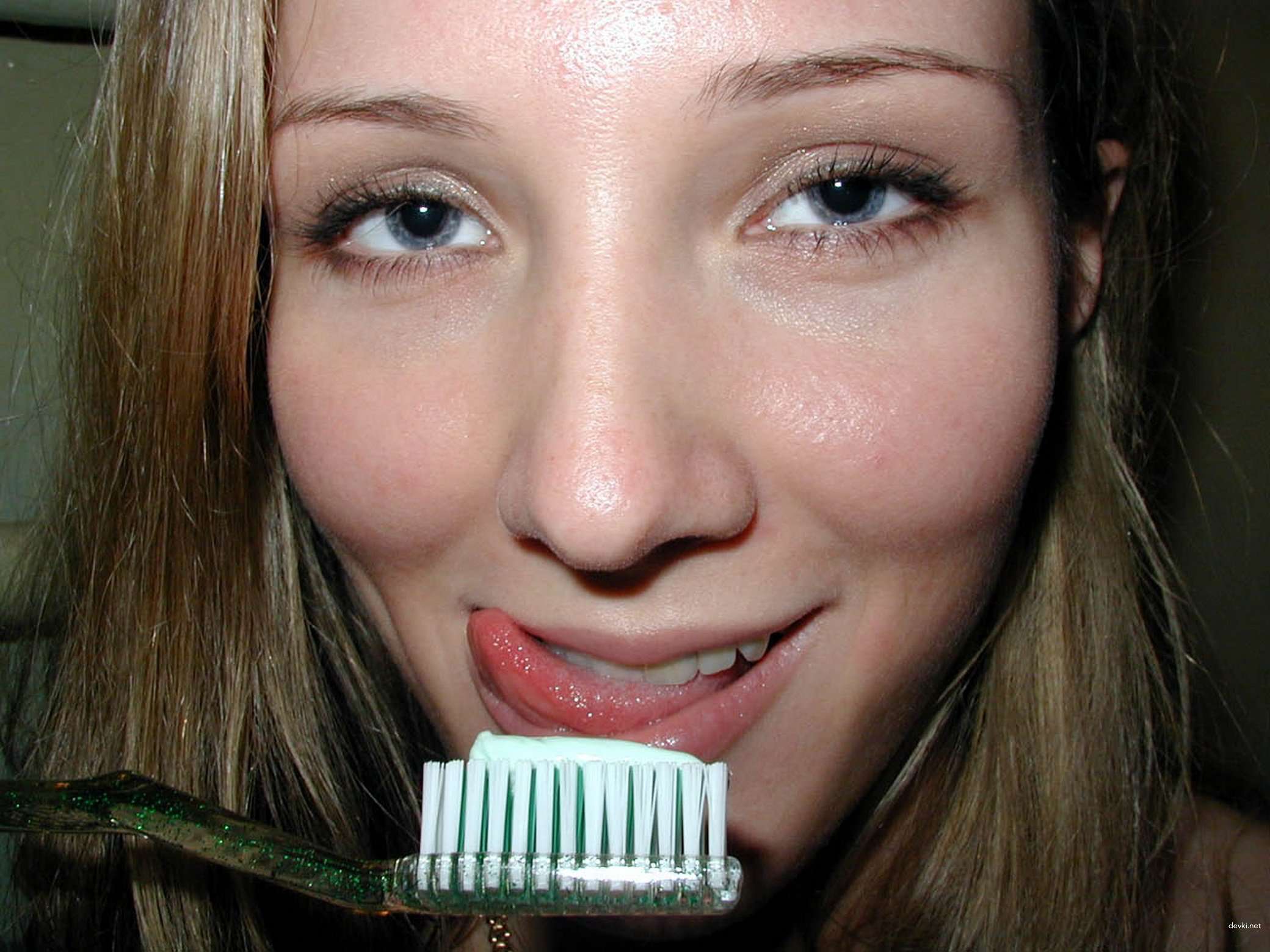 Amateur Babe Teases Wet Pussy with Toothbrush - Explicit Solo Masturbation Photo