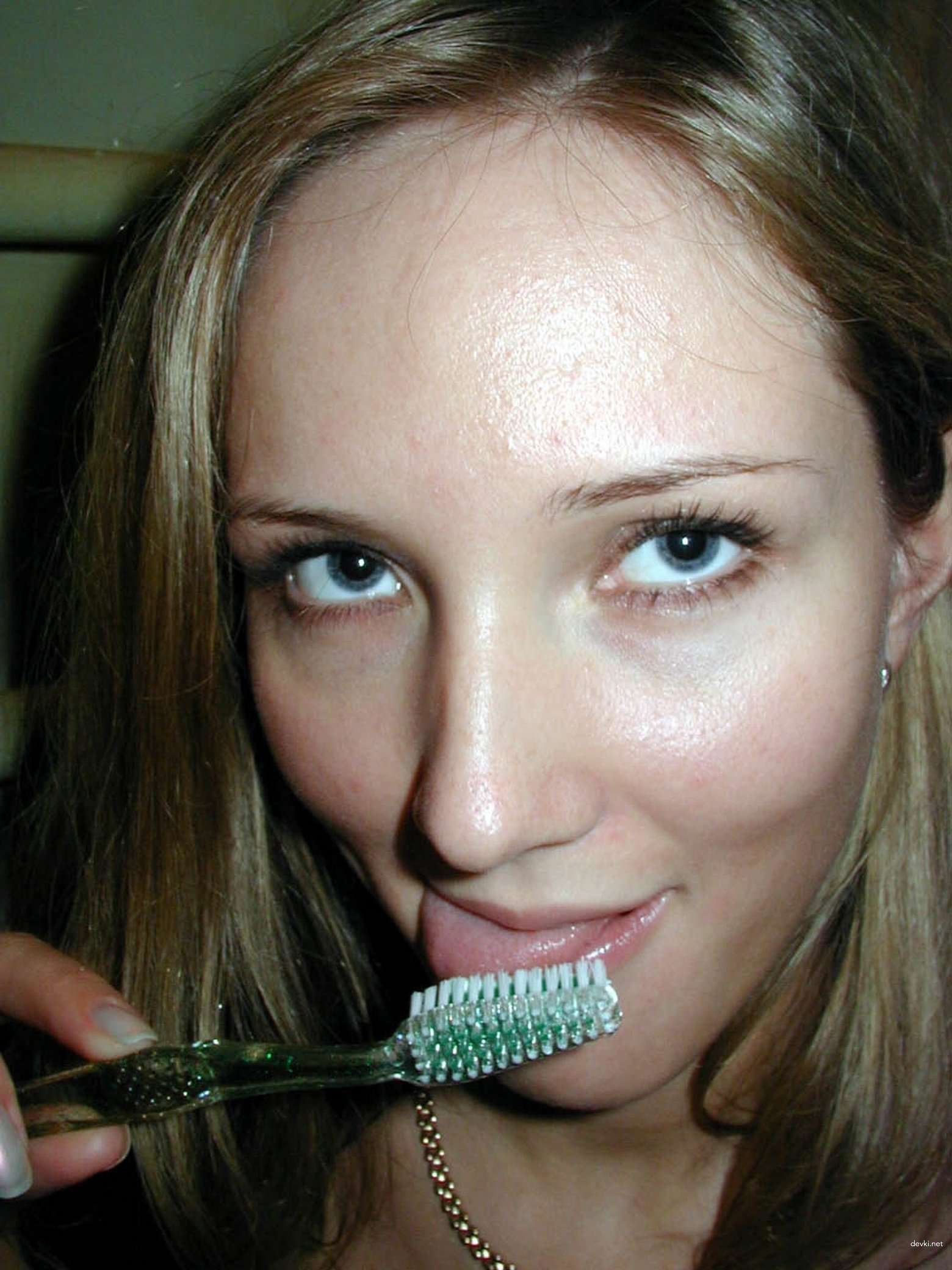 Amateur Babe Teases Wet Pussy with Toothbrush - Explicit Solo Masturbation Photo
