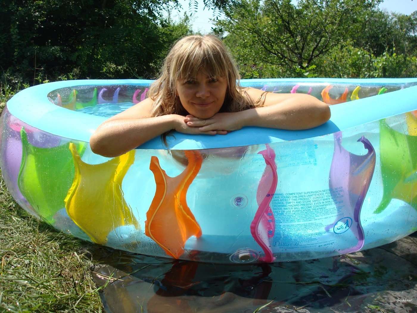 Explicit Nude Amateur Photo Shoot: Naked Girl in Inflatable Pool