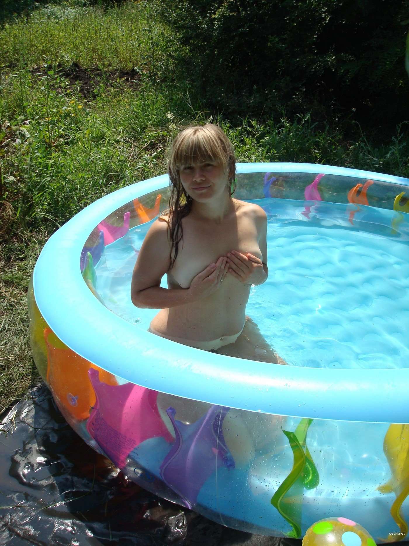 Explicit Nude Amateur Photo Shoot: Naked Girl in Inflatable Pool