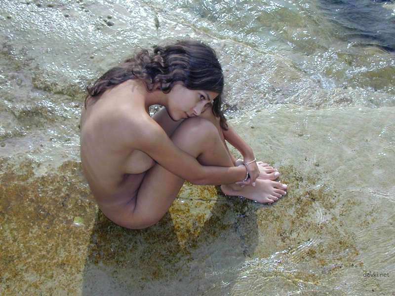 Explicit Nude Beach Photoshoot: Skinny Amateur Poses Boldly by the Sea