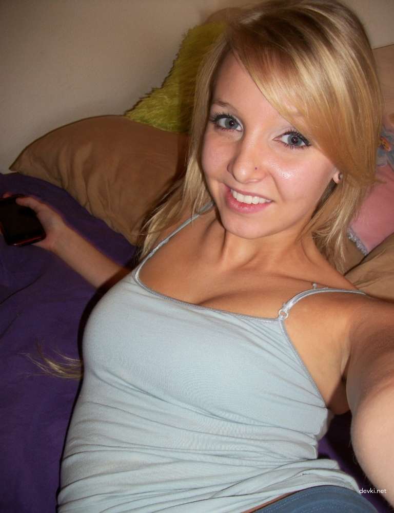 Hot Blonde Undresses on Bed - Explicit Amateur Nude Photo