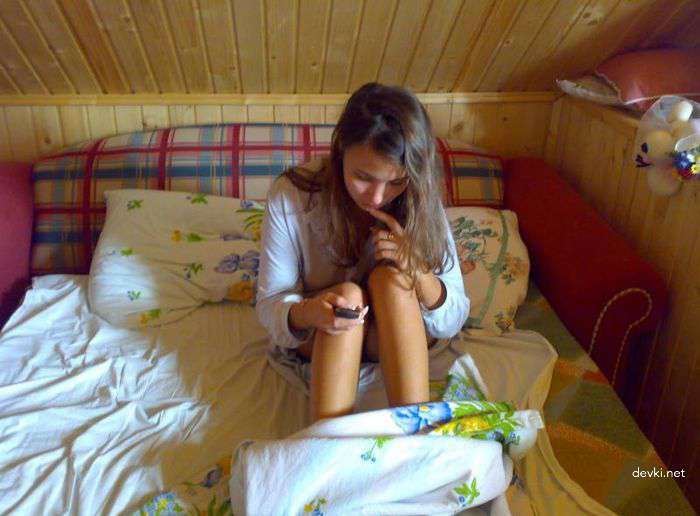 Raw Bedroom Shots: Nude Amateur Lounging in Bed - Explicit Photos