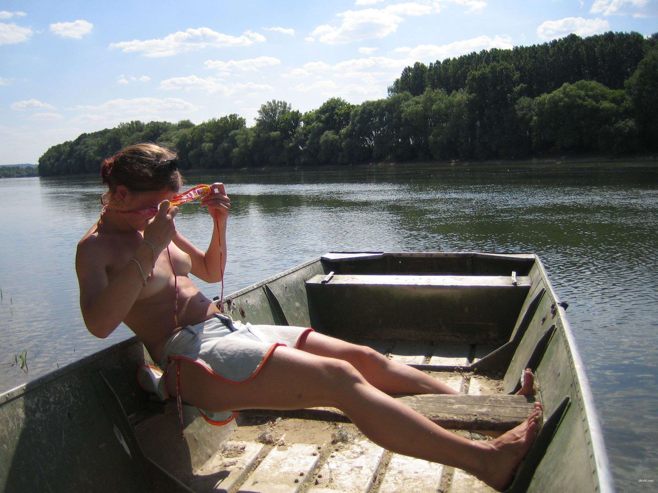 Topless Blonde Amateur Lounging - Explicit Photo Shoot