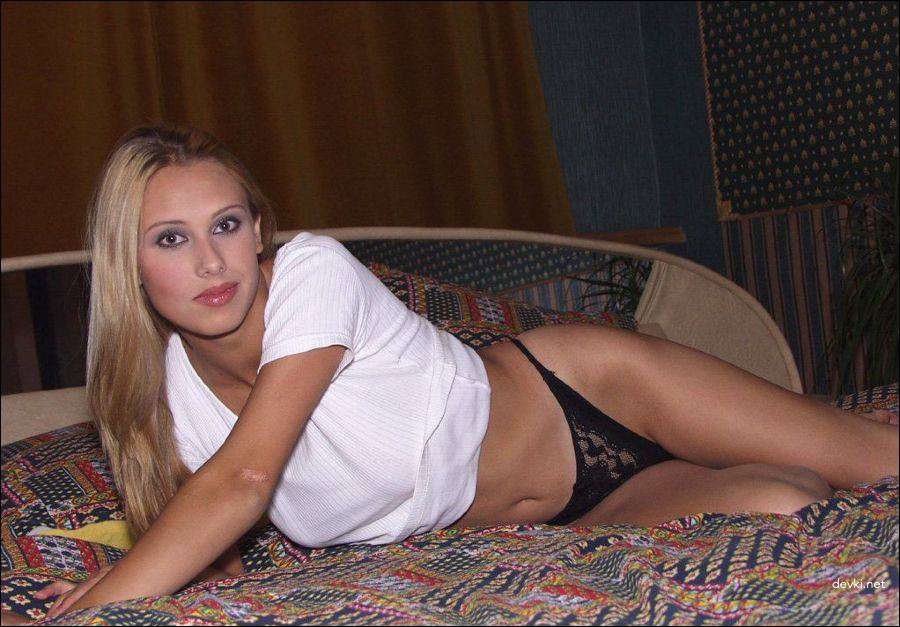 Blonde Bombshell Bares All: Steamy Amateur Strip Tease - XXX Photo
