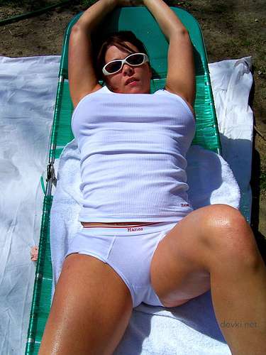 Busty Amateur Seductively Poses in Sensual Erotica Photoshoot