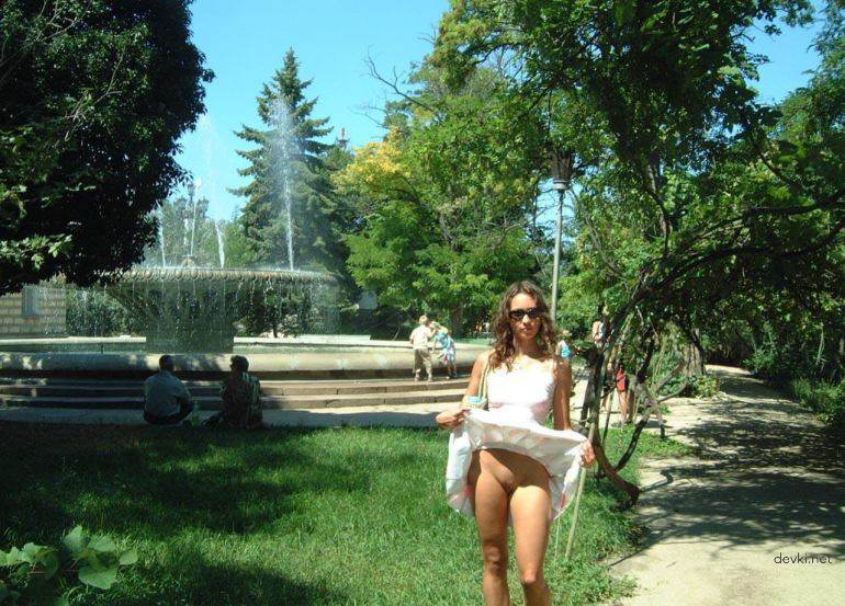 Explicit Amateur Stripper Show: Public Girl Striptease Photo