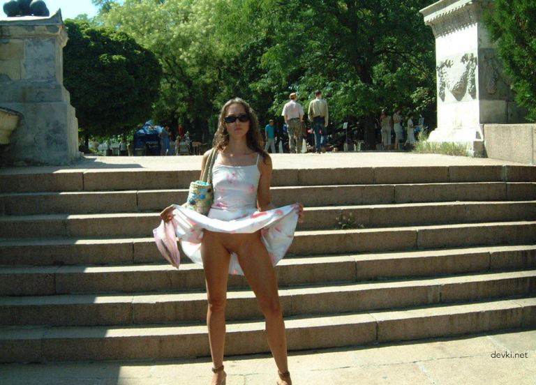 Explicit Amateur Stripper Show: Public Girl Striptease Photo