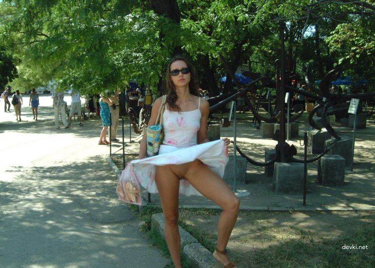Explicit Amateur Stripper Show: Public Girl Striptease Photo