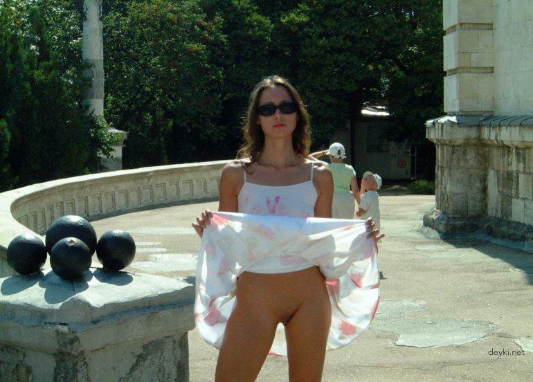Explicit Amateur Stripper Show: Public Girl Striptease Photo