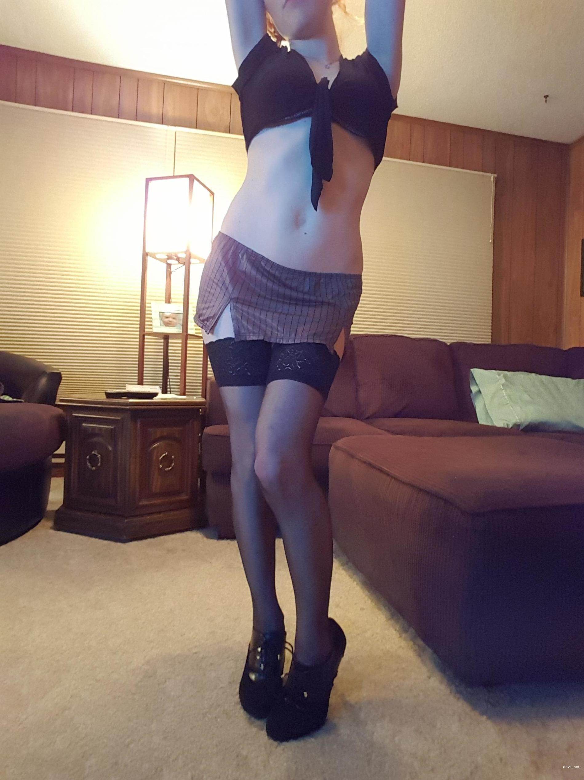 Sultry Redhead in Fishnet Stockings: Uncensored Amateur Erotic Pic